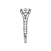 A side view of the Elongated Cushion cut diamond engagement ring in 14k white gold  with a channel band and hidden halo setting