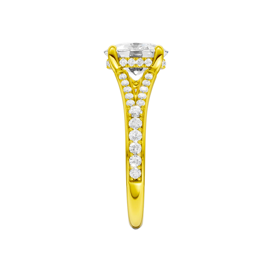 A side view of the Elongated Cushion cut diamond engagement ring in 14k yellow gold  with a channel band and hidden halo setting