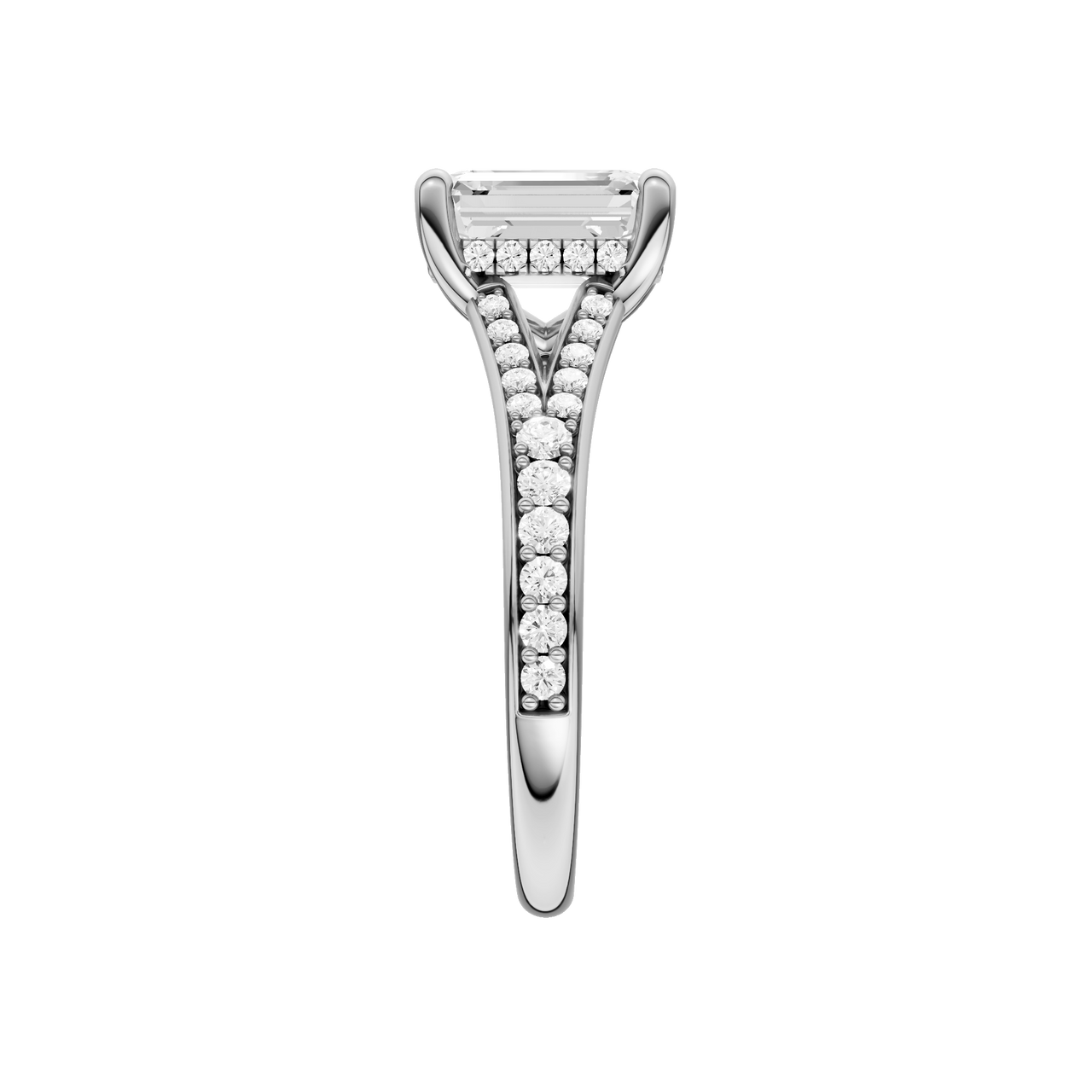 A side view of the Emerald cut diamond engagement ring in 14k platinum with a diamond channel band and split setting