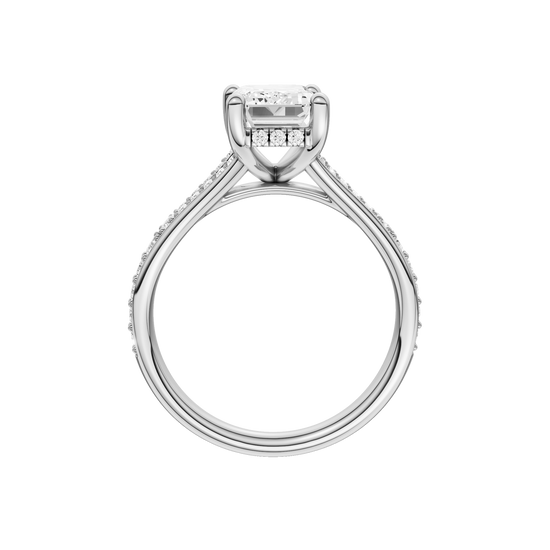 A profile view of the Emerald cut diamond engagement ring in 14k white gold with a diamond channel band and split setting