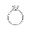 A profile view of the Oval cut diamond engagement ring in platinum with a channel band and hidden halo setting