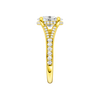 A side view of the Oval cut diamond engagement ring in 14k yellow gold with a channel band and hidden halo setting