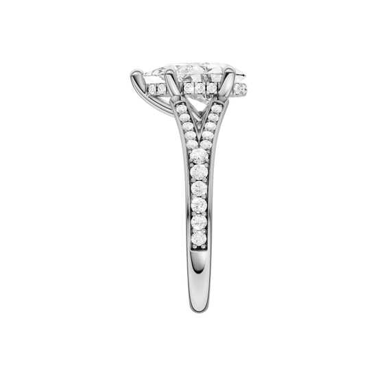 A side view of the Pear cut diamond engagement ring in 14k white gold with a channel band and cathedral setting