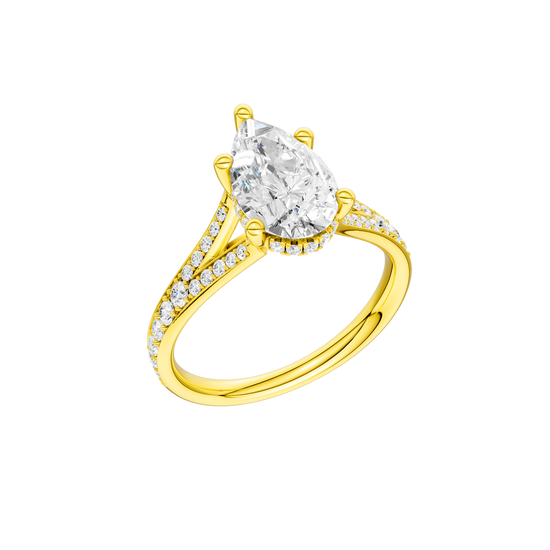 A three-quarter view of the Pear cut diamond engagement ring in 14k yellow gold with a channel band and cathedral setting