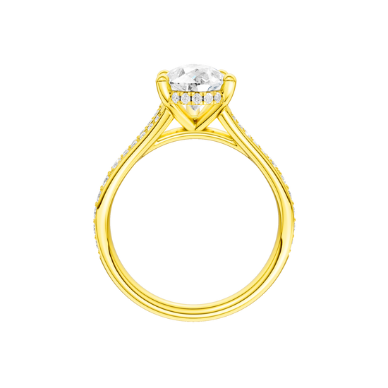 A profile view of the Pear cut diamond engagement ring in 14k yellow gold with a channel band and cathedral setting