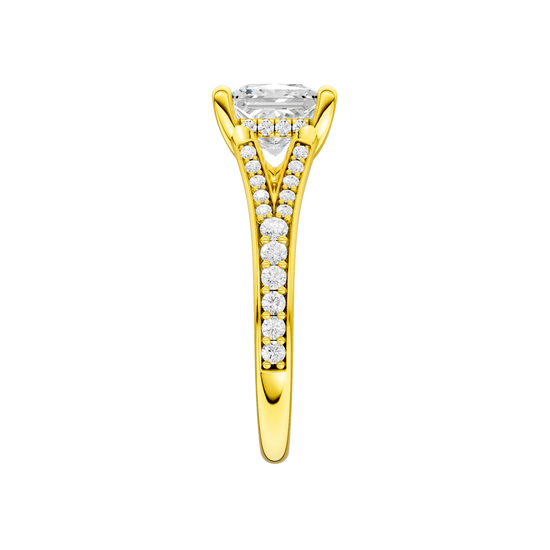 A side view of the Princess cut diamond engagement ring in 14k yellow gold with a diamond channel band and split setting