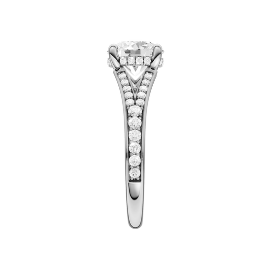 A side view of the Round cut diamond engagement ring in 14k white gold with a channel band and hidden halo setting