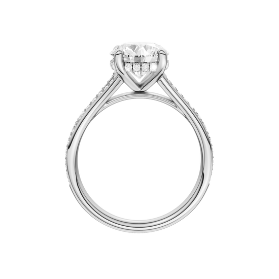 A profile view of the Round cut diamond engagement ring in 14k white gold with a channel band and hidden halo setting