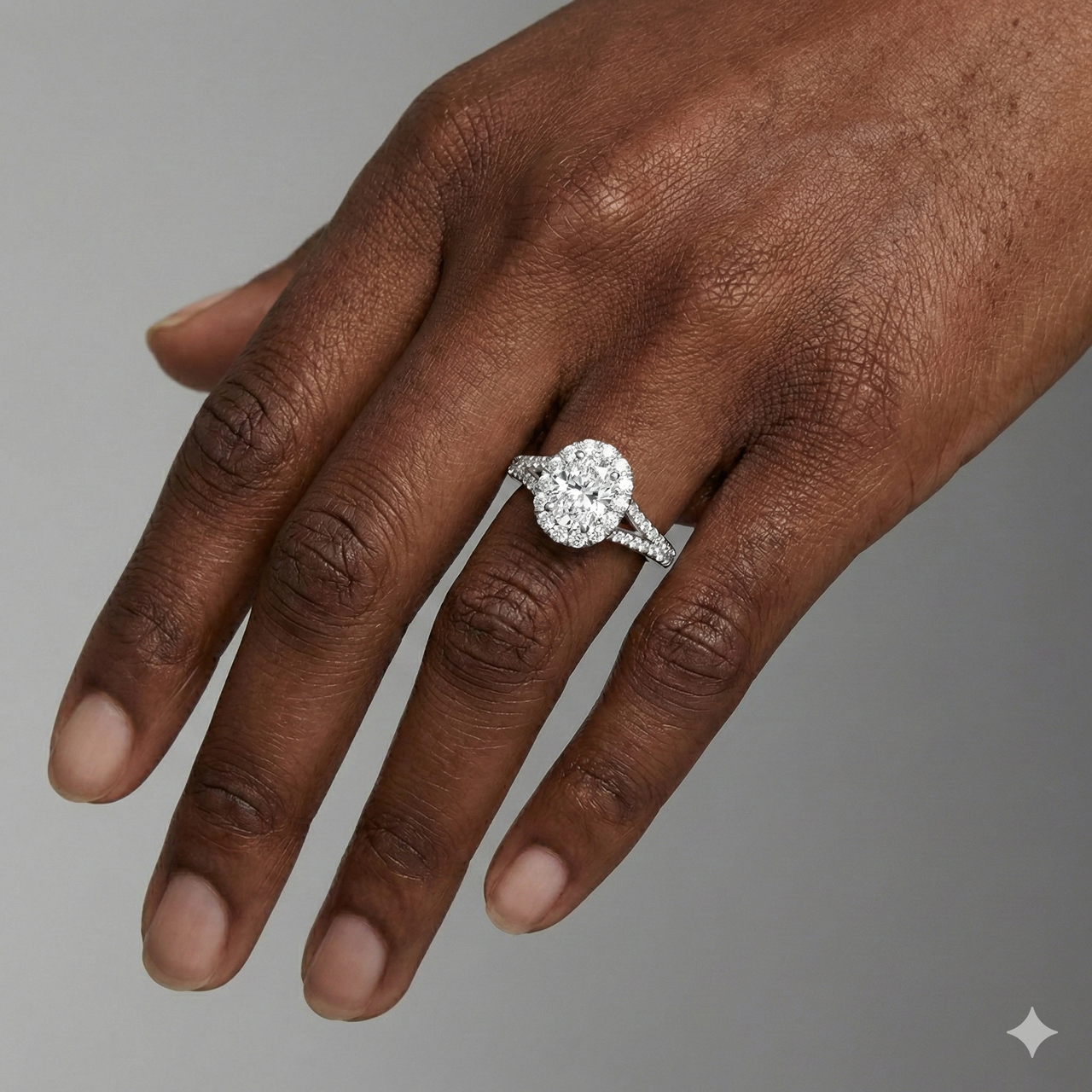 Elongated cushion cut diamond engagement ring in 14k white gold with a diamond channel band and split setting on a hand