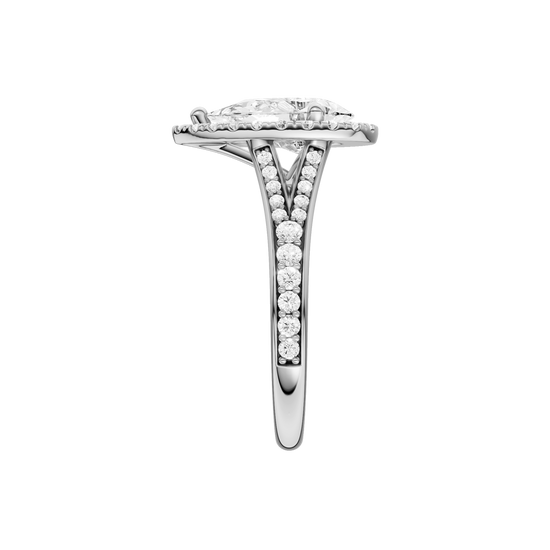 A side view of the Pear cut diamond engagement ring in platinum with a diamond channel band and split setting