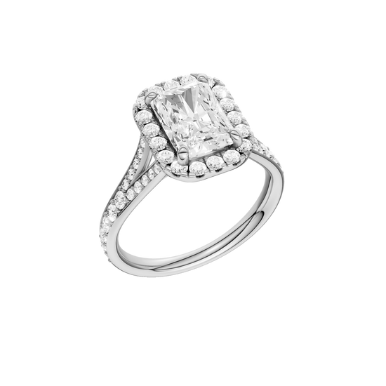 A three-quarter view of the Radiant cut diamond engagement ring in platinum with a diamond channel band and split setting