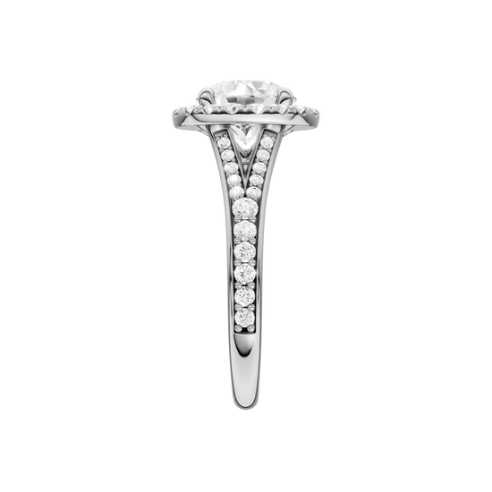 A side view of the Round cut diamond engagement ring in platinum with a diamond channel band and split setting