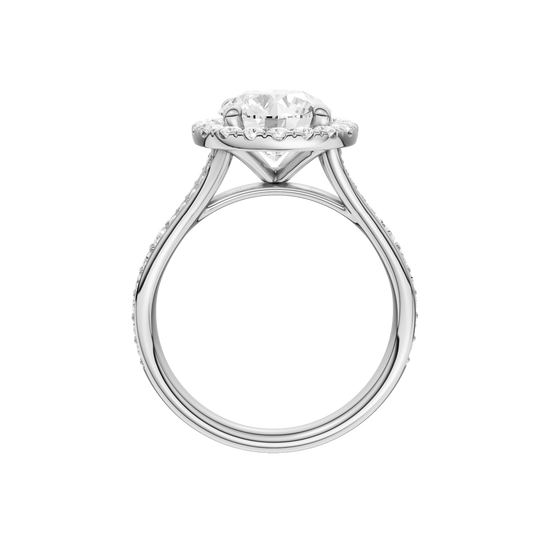 A profile view of the Round cut diamond engagement ring in 14k white gold with a diamond channel band and split setting