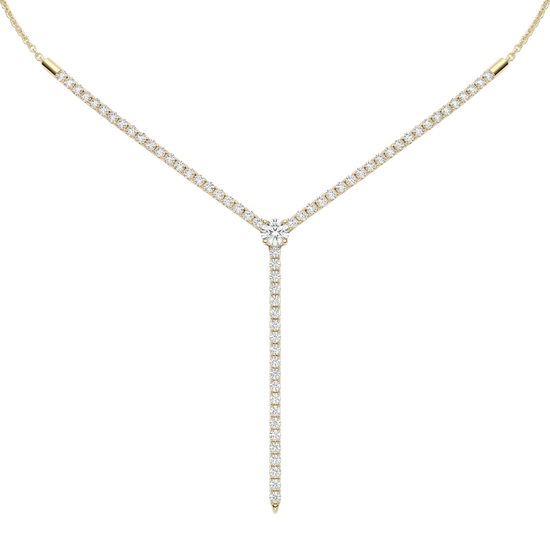 A close-up of the delicate 14K yellow gold diamond drop necklace (Valletta Strand) and the subtle diamond bar pendant.