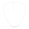 Wide view of a white gold diamond station necklace featuring round white diamonds spaced along a delicate chain in a refined fine jewelry style.