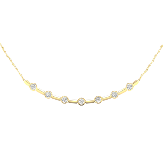 Close-up view of round white diamonds set in a yellow gold station necklace, highlighting diamond brilliance, setting detail, and polished gold finish.
