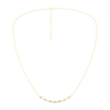Wide view of a yellow gold diamond station necklace featuring round white diamonds spaced along a delicate chain in a classic fine jewelry design.