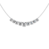 Zoomed in front view of a delicate graduated emerald-cut diamond necklace in white gold, featuring smaller step-cut diamonds arranged in a refined curved silhouette on a fine chain.