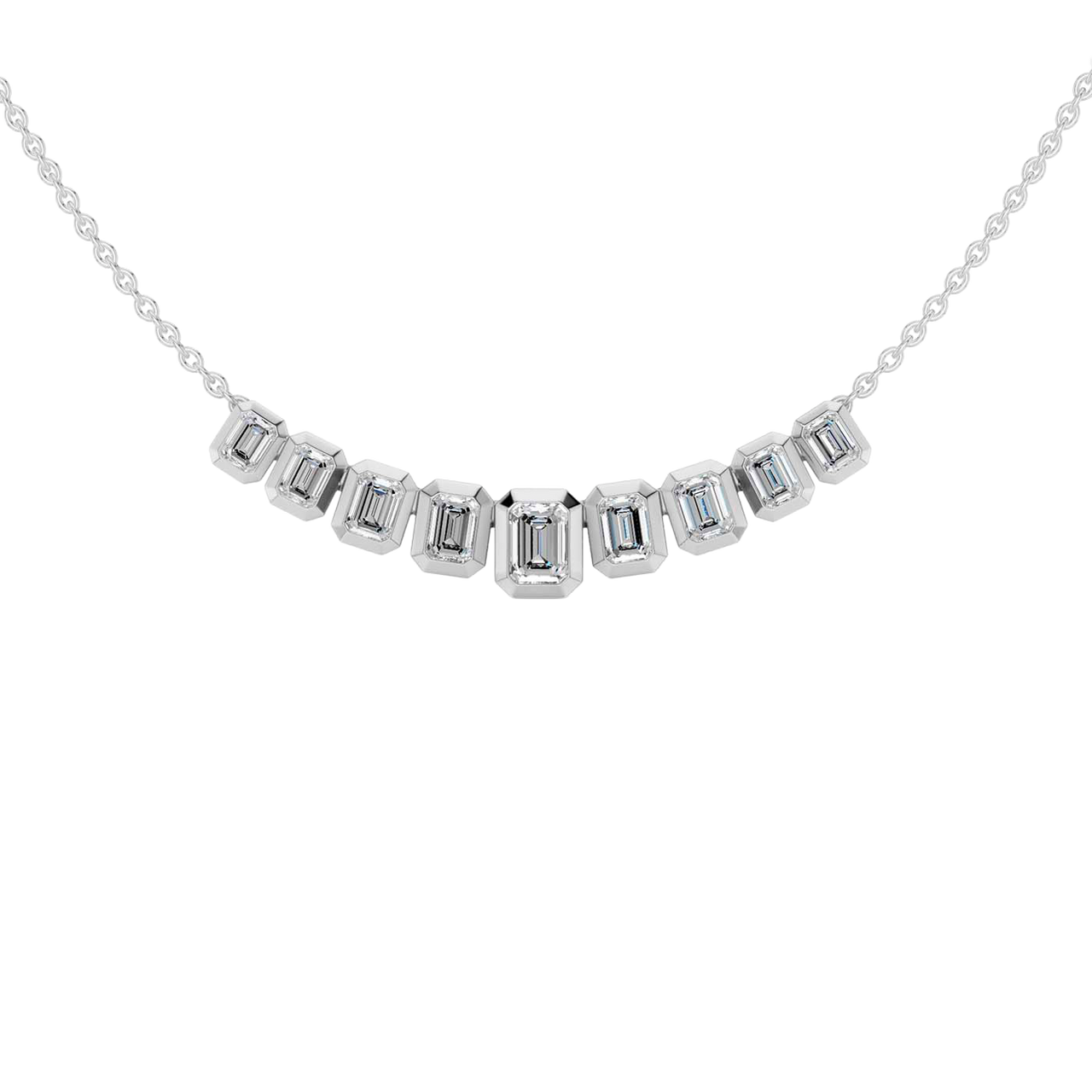 Zoomed in front view of a delicate graduated emerald-cut diamond necklace in white gold, featuring smaller step-cut diamonds arranged in a refined curved silhouette on a fine chain.