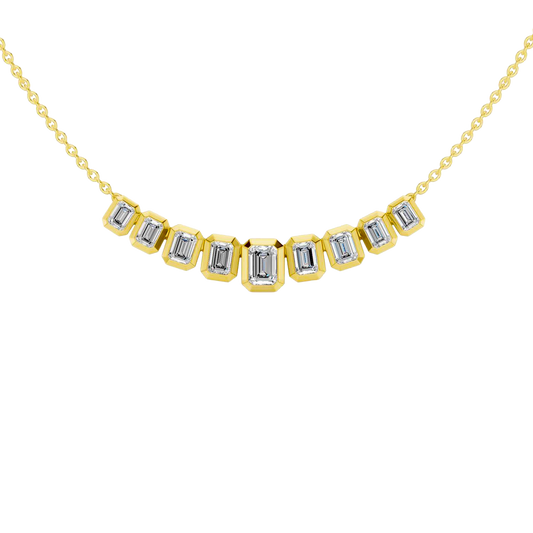 Front view of a delicate graduated emerald-cut diamond necklace in yellow gold, featuring smaller step-cut diamonds arranged in a soft curved silhouette.