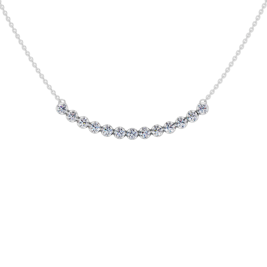 Up close front view of a white gold necklace featuring round white diamonds set along a gently curved design on a delicate chain.