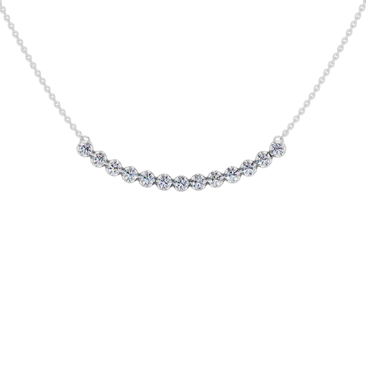 Up close front view of a white gold necklace featuring round white diamonds set along a gently curved design on a delicate chain.