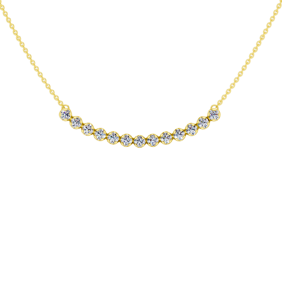Up close front view of a yellow gold necklace featuring round white diamonds set along a gently curved design on a delicate chain.