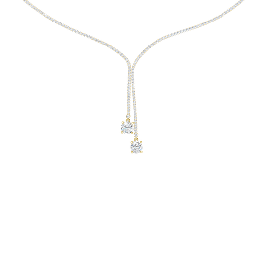 A close-up of the delicate 14K yellow gold diamond lariat Y necklace (Versailles Plunge) on a light background.