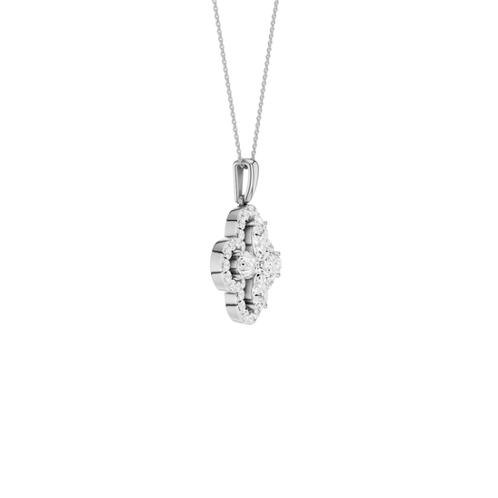 Angled view of a white gold pendant necklace featuring white diamonds and a warm polished gold finish.