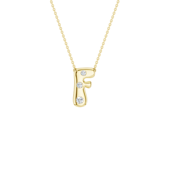 A product shot of a yellow gold necklace featuring a fine cable chain attached to the top curves of a smooth, bubble-font letter 'H' pendant. The polished gold 'H' is embellished with four sparkling, flush-set round diamonds: one on the middle left stem, one on the upper right stem, and one positioned at the bottom of each vertical stem.