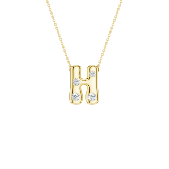 A product shot of a yellow gold necklace featuring a fine cable chain attached to the top curves of a smooth, bubble-font letter 'H' pendant. The polished gold 'H' is embellished with four sparkling, flush-set round diamonds: one on the middle left stem, one on the upper right stem, and one positioned at the bottom of each vertical stem.