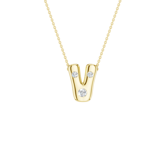 A product shot of a yellow gold necklace featuring a fine cable chain attached to the top curves of a smooth, bubble-font letter 'V' pendant. The polished gold 'V' is embellished with three sparkling, flush-set round diamonds: one situated on each of the top tips, and one at the bottom point.