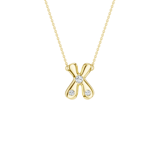 A product shot of a yellow gold necklace featuring a fine cable chain attached to the top arms of a smooth, bubble-font letter 'X' pendant. The polished gold 'X' is embellished with three sparkling, flush-set round diamonds: one situated perfectly in the center cross, and one on each of the bottom legs.