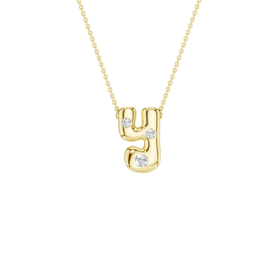 A product shot of a yellow gold necklace featuring a fine cable chain attached to a smooth, bubble-font lowercase letter 'Y' pendant. The polished gold 'Y' is embellished with three sparkling, flush-set round diamonds placed along its curves.