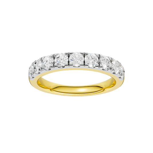 A top-down view of a 14K yellow gold band ring with a continuous line of brilliant rectangular diamonds.