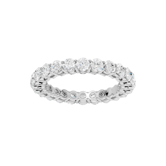 A top-down view of a 14K white gold eternity band with a continuous line of brilliant oval jewels.