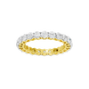 A top-down view of a 14K yellow gold eternity band with a continuous line of brilliant oval jewels.