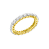 An angled view of a 14K yellow gold eternity band, highlighting the continuous sparkle of the oval jewels.