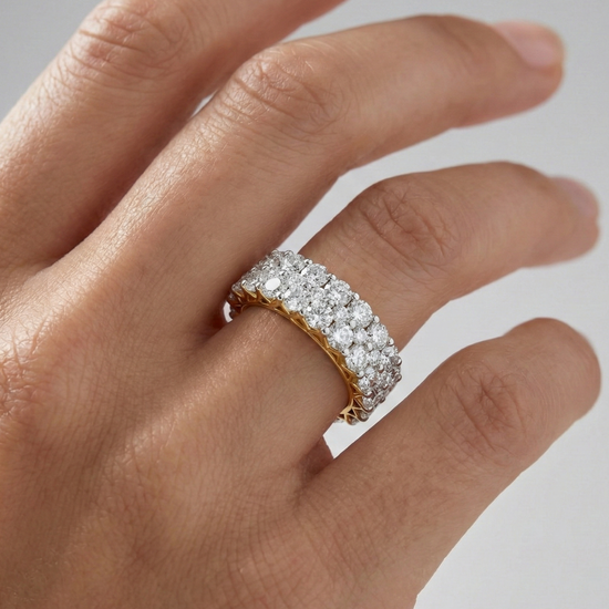 A breathtaking 14k yellow gold full eternity band featuring two rows of shimmering round-cut lab-grown diamonds totaling 3.0 carats on hand.