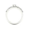 A side-profile view of a 14K white gold ring, showing the fluid band and the five-stone cluster.