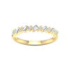 A top-down view of a 14K yellow gold band ring with an alternating pattern of baguette and round diamonds.