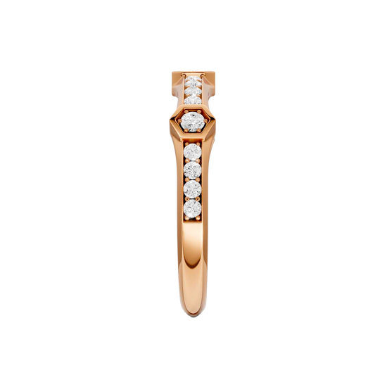 A side-profile view of a 14K rose gold geometric ring, showing the fluid band and the bezel-set diamonds.
