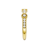 A side-profile view of a 14K yellow gold geometric ring, showing the fluid band and the bezel-set diamonds.