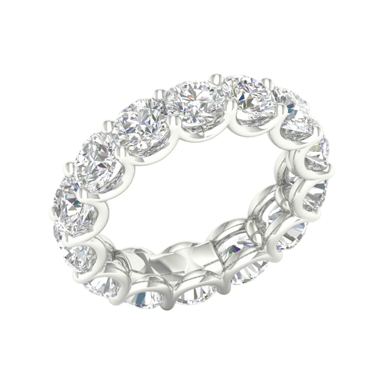 An angled view of a 14K white gold ring, showcasing the seamless brilliance of the bezel-set jewels.