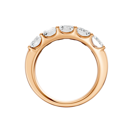 A side-profile view of a 14K rose gold wide band ring, showing the tapered design and the five diamonds.