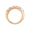 A side-profile view of a 14K rose gold wide band ring, showing the tapered design and the five diamonds.