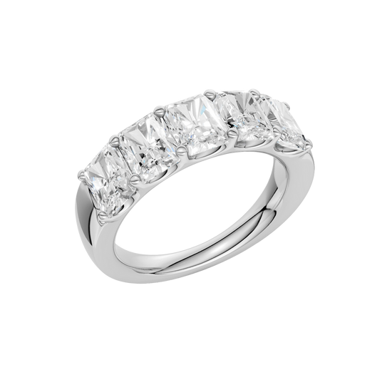 An angled view of a 14K white gold wide band ring, showcasing the clean, bold lines of the tapered diamonds.
