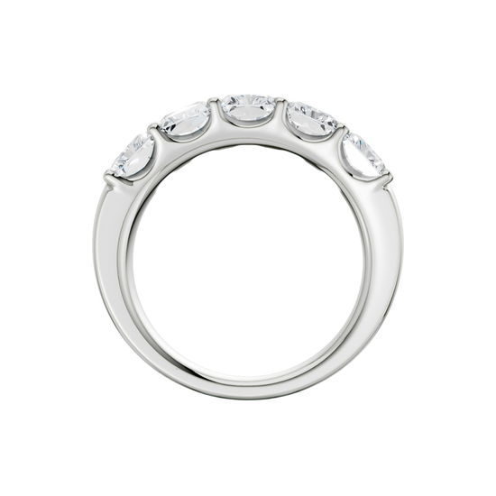 A side-profile view of a 14K white gold wide band ring, showing the tapered design and the five diamonds.