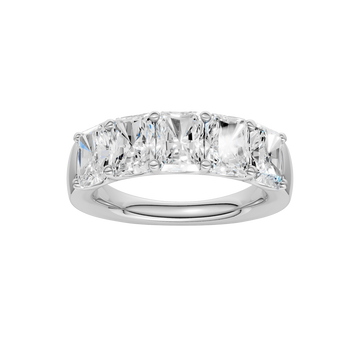A top-down view of a 14K white gold wide band ring with five horizontally-set emerald-cut diamonds, with the center one being larger.