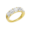An angled view of a 14K yellow gold wide band ring, showcasing the clean, bold lines of the tapered diamonds.